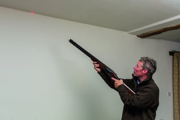 Imagine that where the ceiling and wall meet is the line of a crossing target. Keep the gun moving along the imaginary flight line of the target.