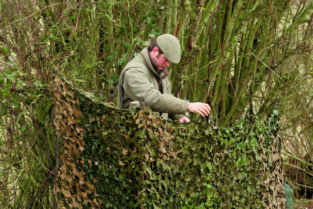 Man in pigeon hide