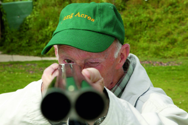 Man shooting with an eye closed 