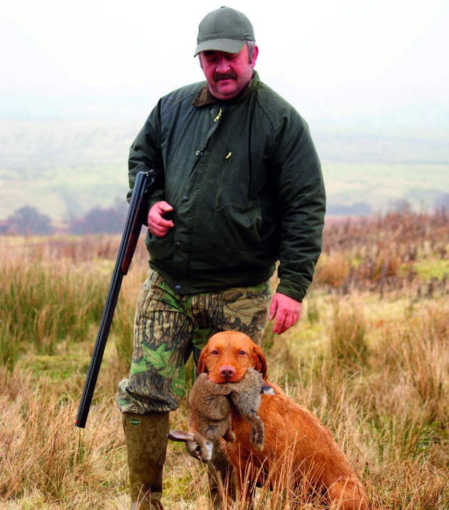 Gun with dog