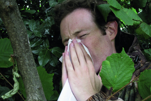 man blowing nose 