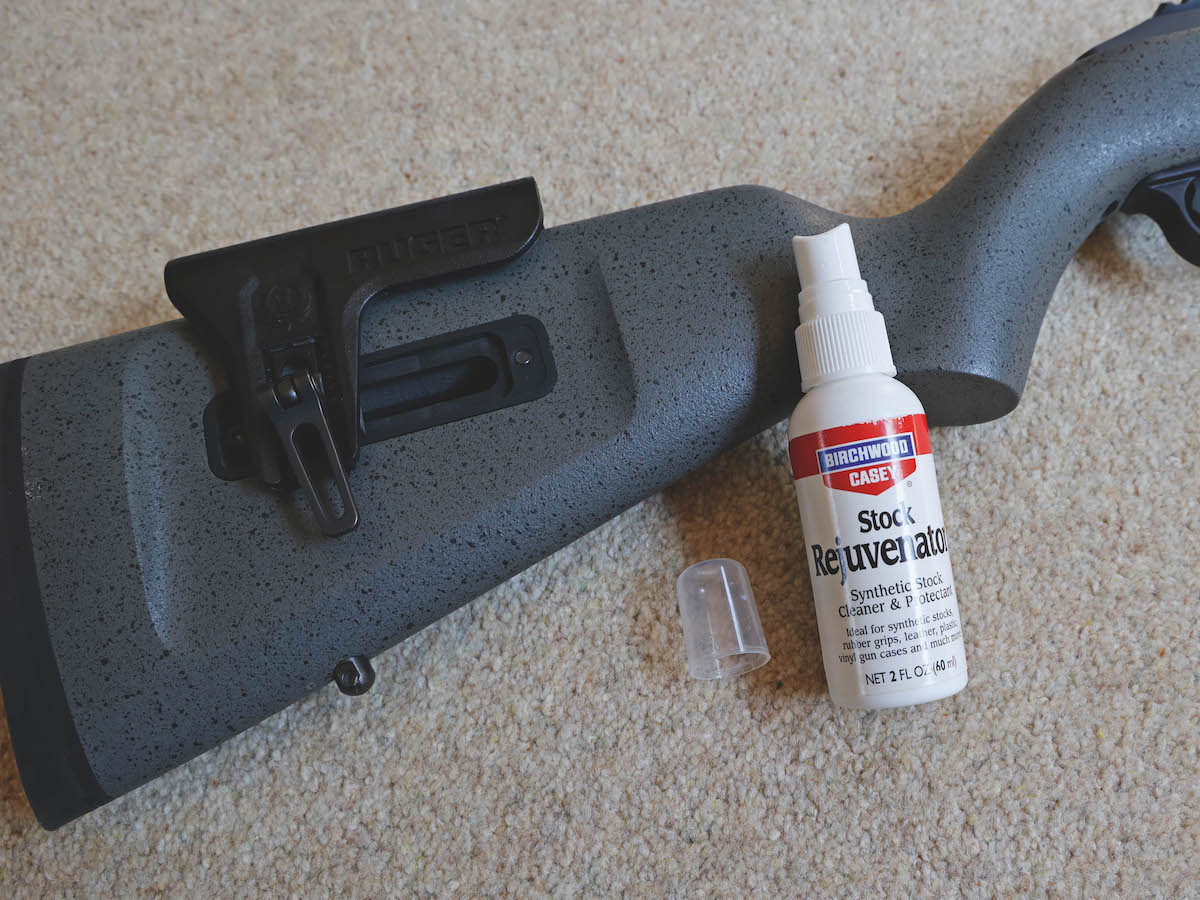 How can I touch up and clean a scuffed synthetic gun stock?