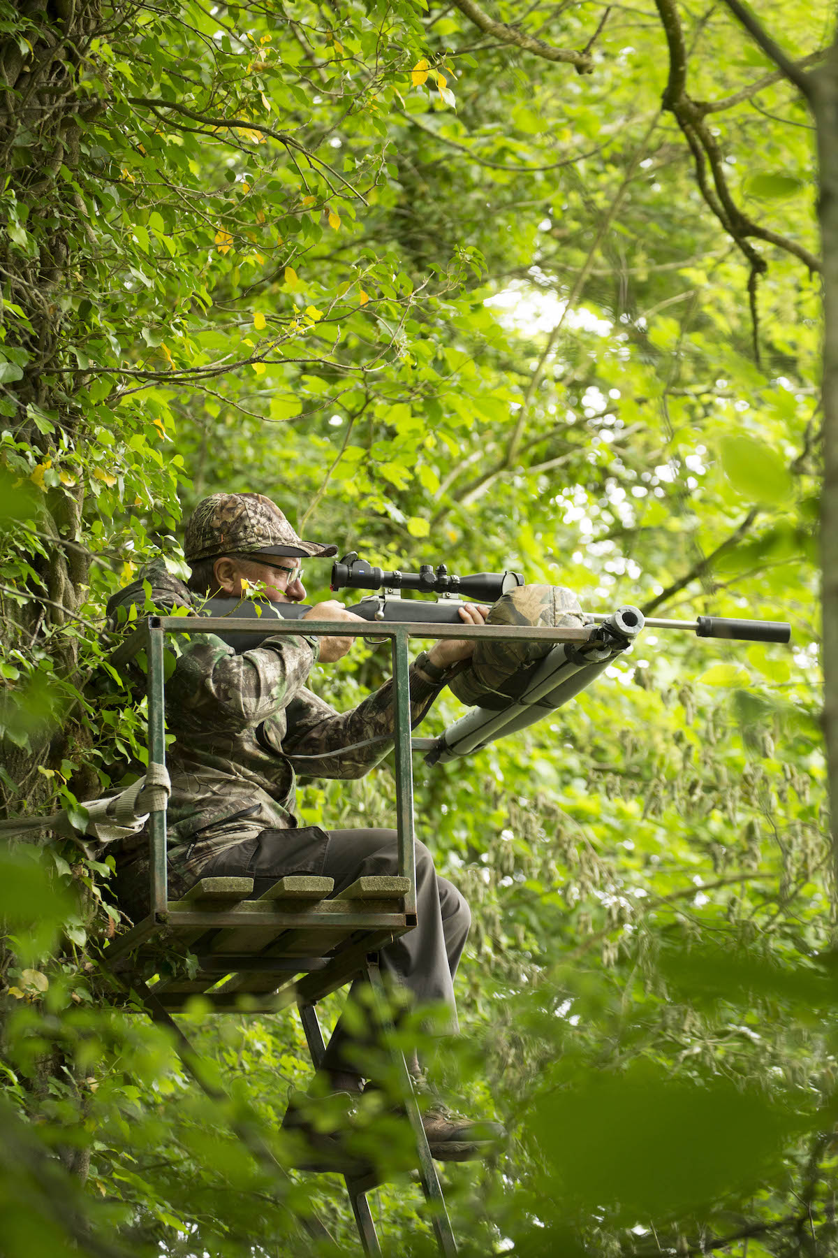 Man on high seat with rifle 