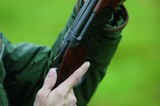 man with shotgun 