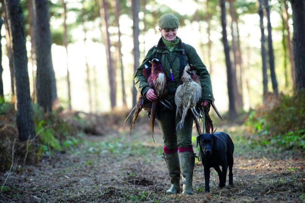 woman with pheasant on shoot