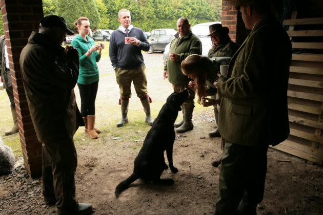 black labrador with owner