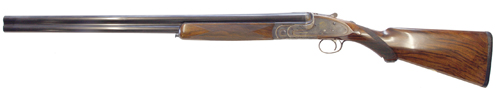 ></noscript></img><br />
This is a virtually new Purdey over-under, which was made in the early 1990s. It has 28″ barrels with multichokes by Nigel Teague, who really is the best in the business. <br />
<br />
The engineering in these guns is second to none in terms of best quality English over-unders, and the quality of Purdey?s manufacturing shines through here. <br />
<br />
Wood to metal fit is exquisite, and the gun has been engraved beautifully. <br />
<br />
It is a very elegant gun, with a colour hardened finish. As is quite common on English over-unders this gun is ribless, with vestigial sections of rib at each end of the top barrel. <br />
<br />
This brings the weight of the gun down significantly, and means it handles very well. <br />
<br />
It comes complete in its leather and canvas case with all its accessories, and is in wonderful condition. <br />
<br />
A new gun like this would cost in the region of £80,000 today and is simply one of the finest over-unders you can buy. <br />
<br />
At the Game Fair you can expect guns of this quality and condition to be selling for around £50,000. <br />
<br />
Though this seems a lot of money to be putting down outside of a comfortable shop environment you are unlikely to find such an easily accessible collection of quality guns anywhere else.<br />
</p>
<h2><a href=