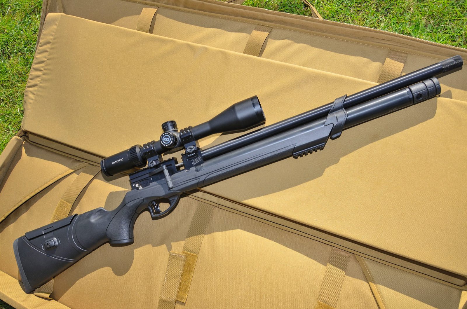 EB Arms Agincourt Synthetic scoped and lying in its padded hard case