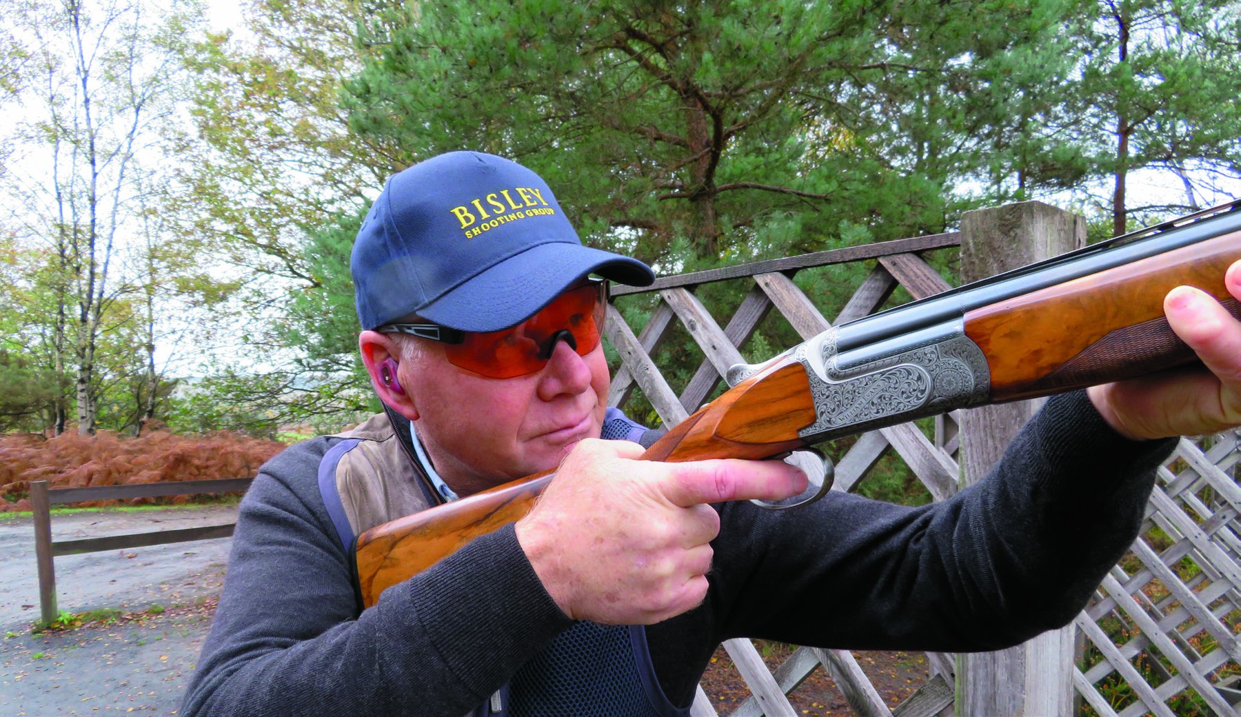 John Heagren at Bisley Shooting Ground wearing Evolution Edge red-lens shooting glasses