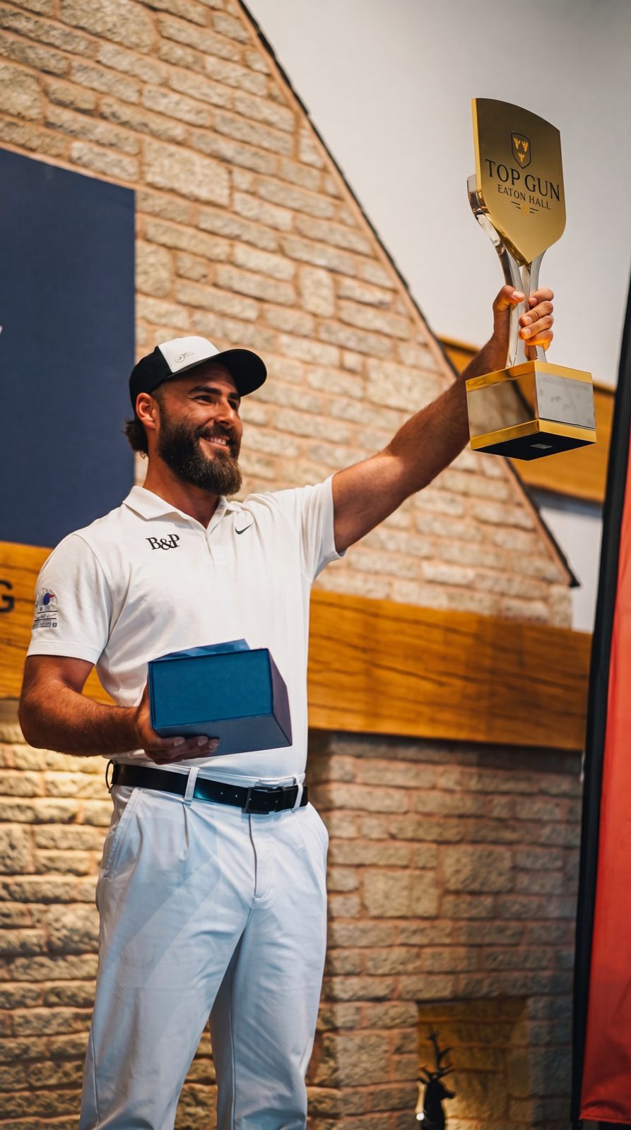 Tamás Jéri holding the trophy as first Eaton Hall TopGun champion