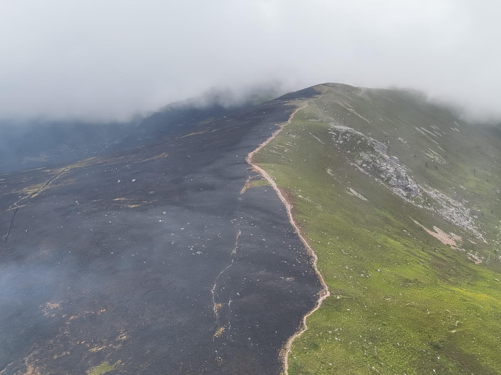 Aerial view of scorched moorland along the ridge after the Cairngorms wildfire near Abernethy