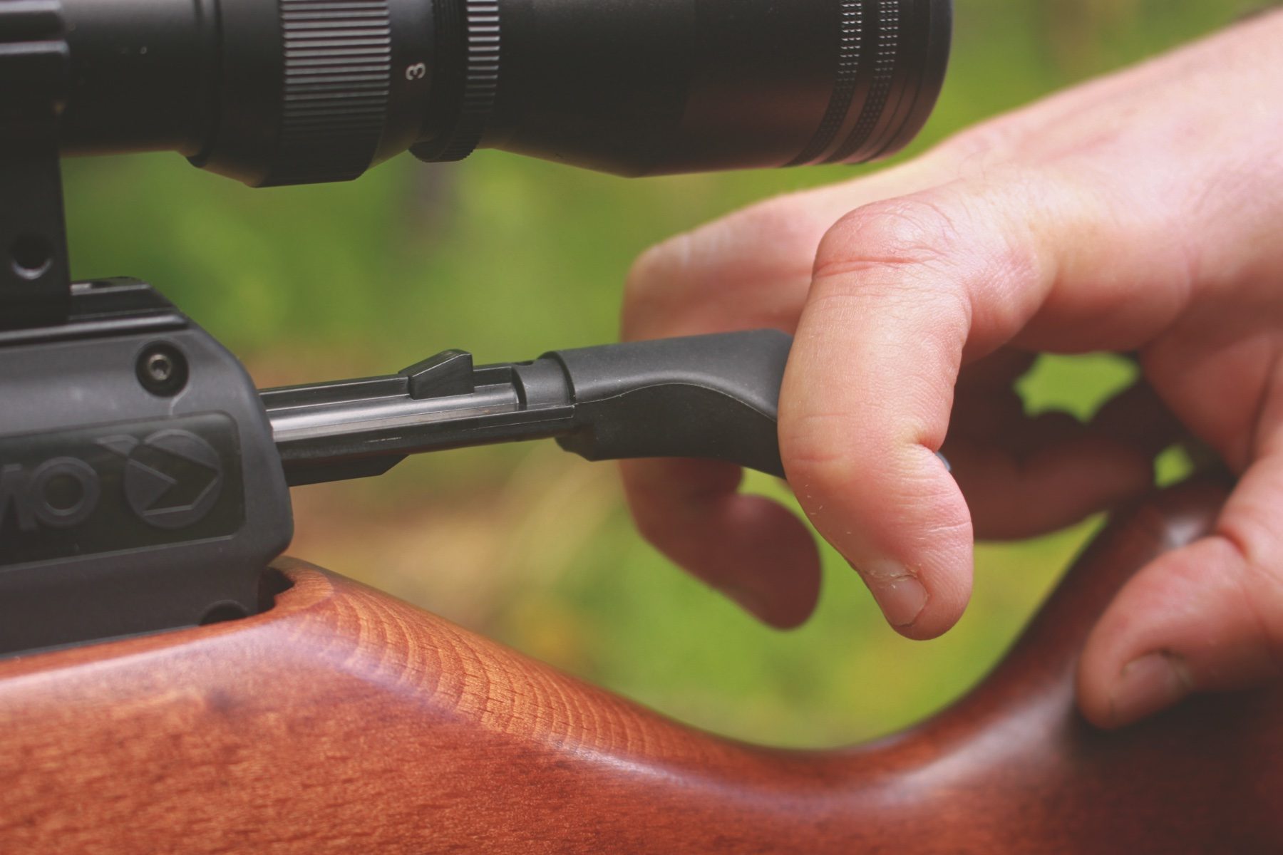 Cocking the Gamo Riser Punisher using two fingers either side of the arrowhead bolt