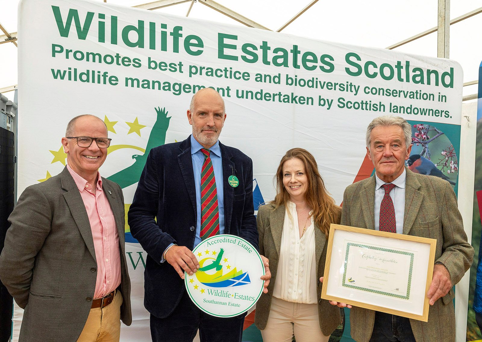 Caroline Pringle and Kenneth Burns of Southannan Estate receiving Wildlife Estates Scotland accreditation