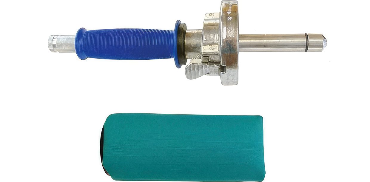 Sporting Saint handheld dummy launcher with a blue grip and a green launcher dummy