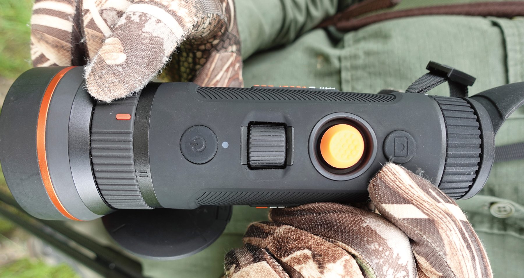 Top-down view of the ThermTec Wild 650 DL PRO focus dial and orange joystick control