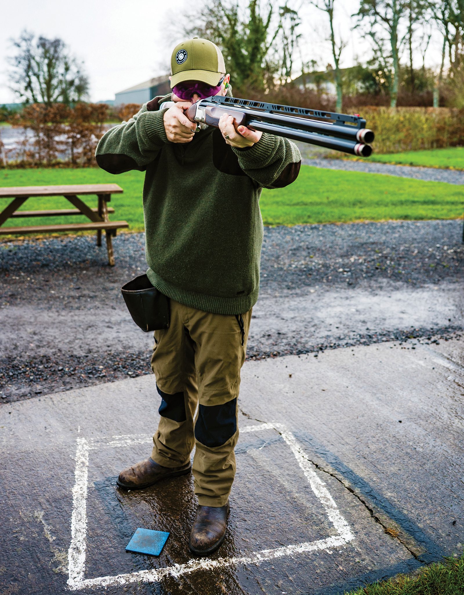 Shooter mounting the Webley & Scott DT Pro trap gun at a clay ground