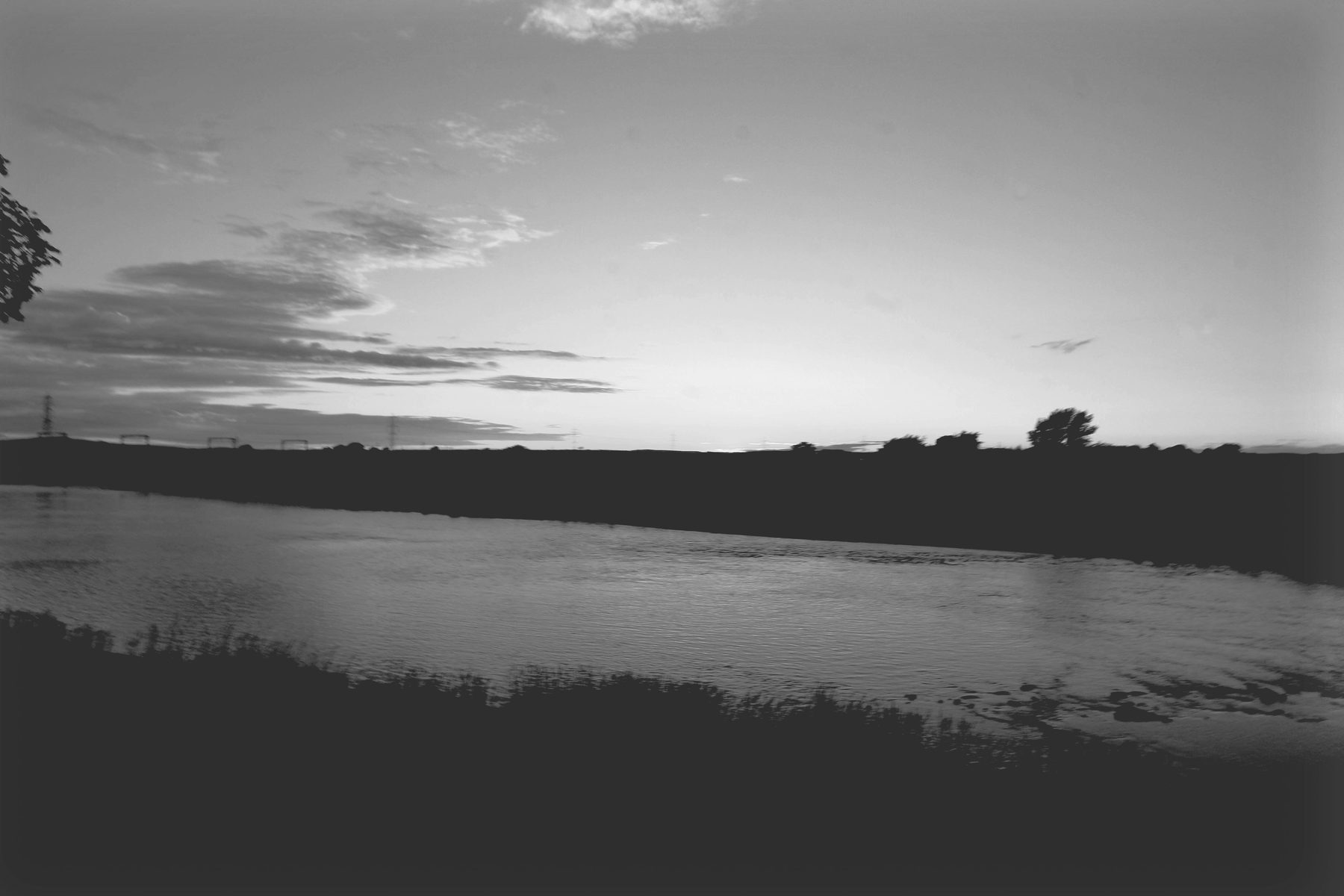 Afterglow over the River Esk at dusk, in black and white