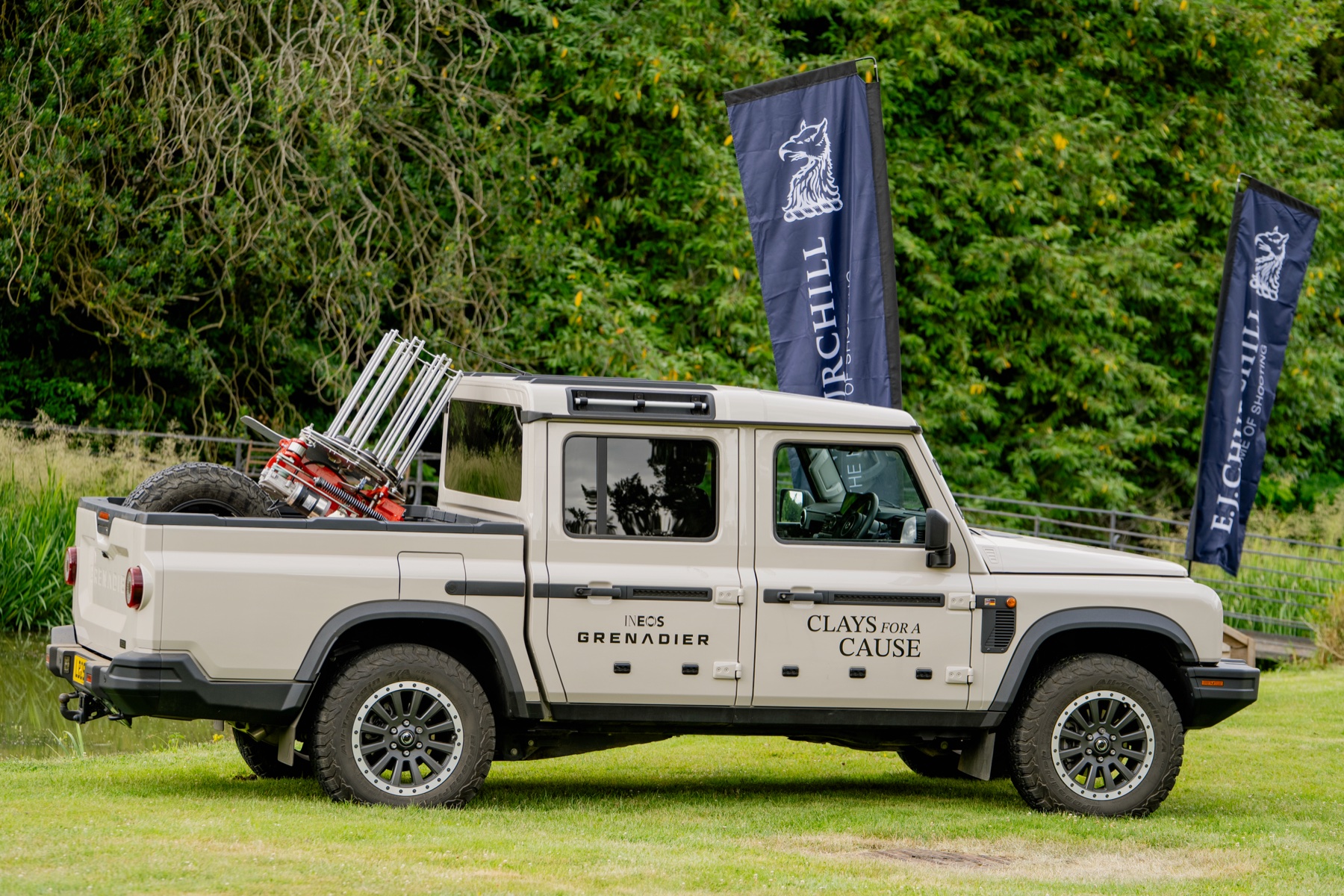 Rear of the Clays for a Cause Grenadier loaded with shooting kit beneath E.J. Churchill flags