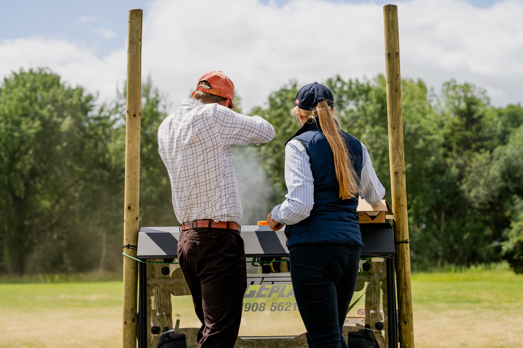 A Gun shooting from a stand at Clays for a Cause with an E.J. Churchill instructor alongside