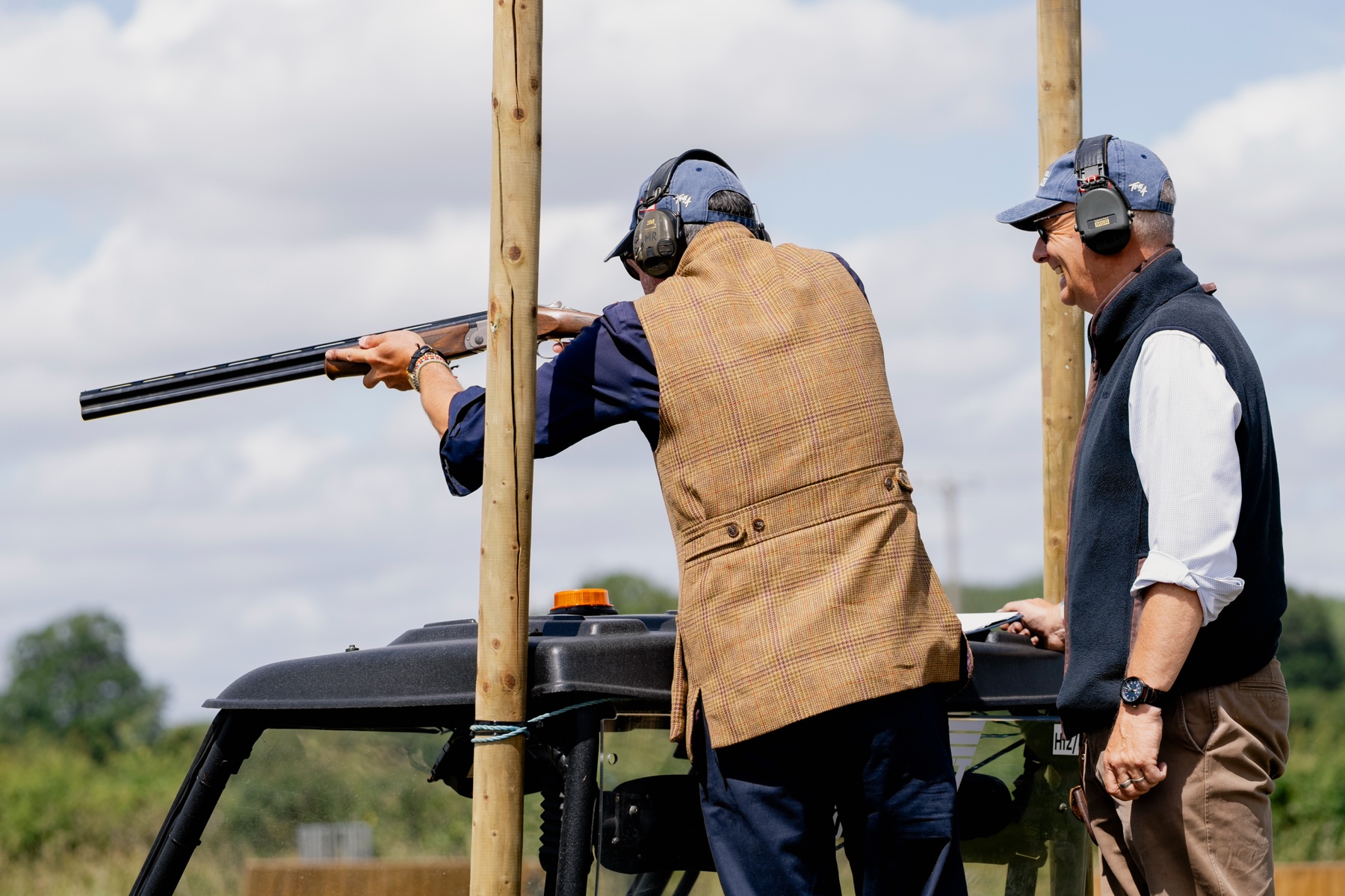 A Gun in tweed mounts the gun as an E.J. Churchill instructor watches