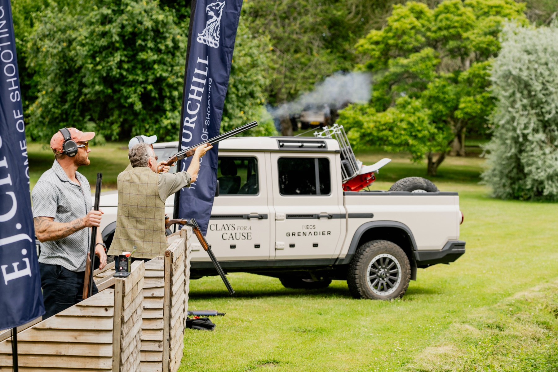 An instructor coaching a Gun on a stand at the Clays for a Cause day