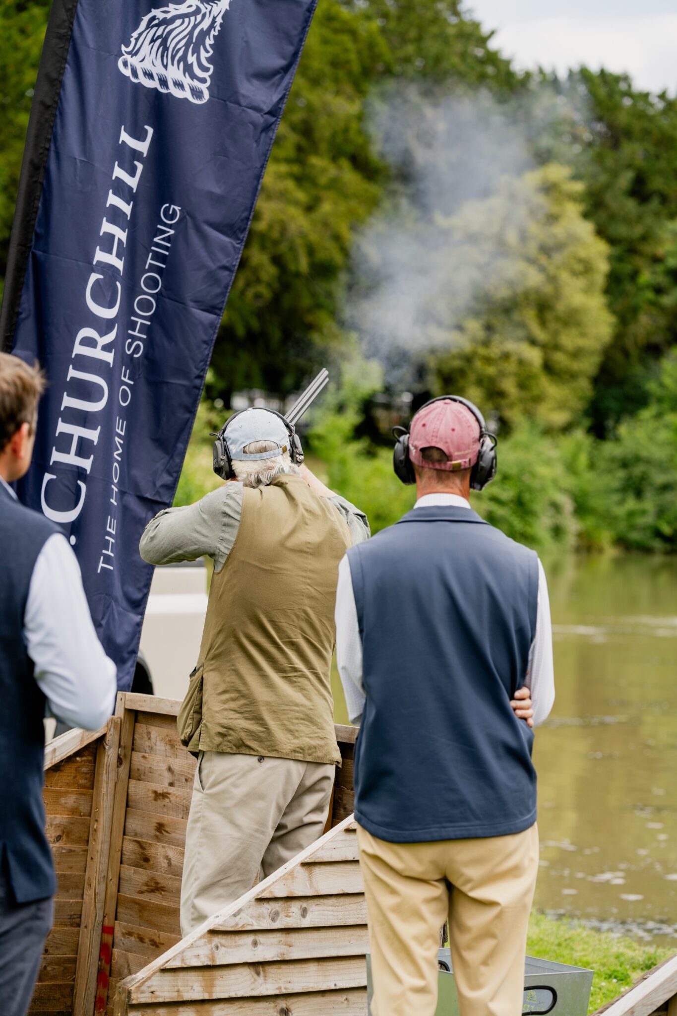Two Guns on the lakeside stand beneath E.J. Churchill flags at Clays for a Cause