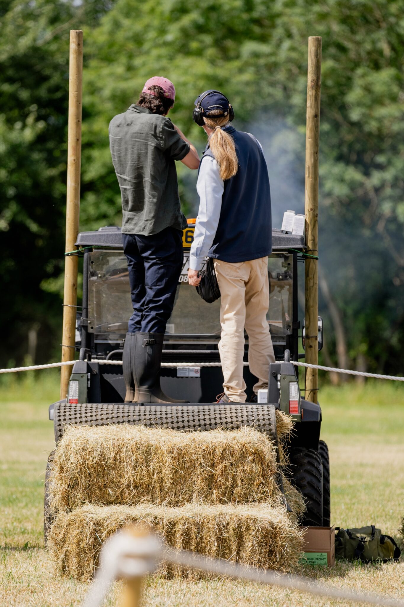 Smoke hanging over a stand as a pair of clays is taken at Clays for a Cause