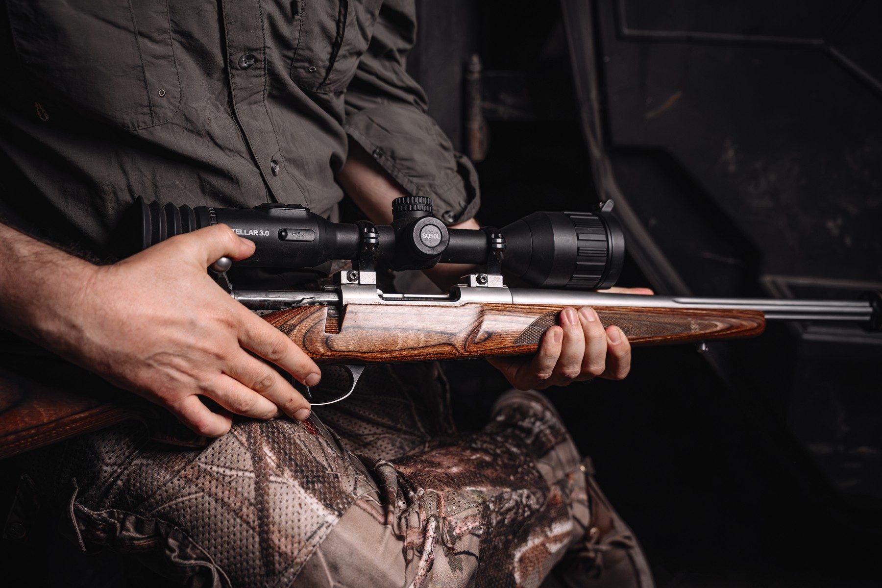 HikMicro Stellar 3.0 SQ50L thermal scope mounted on a Sako 90 Varmint rifle held across the lap