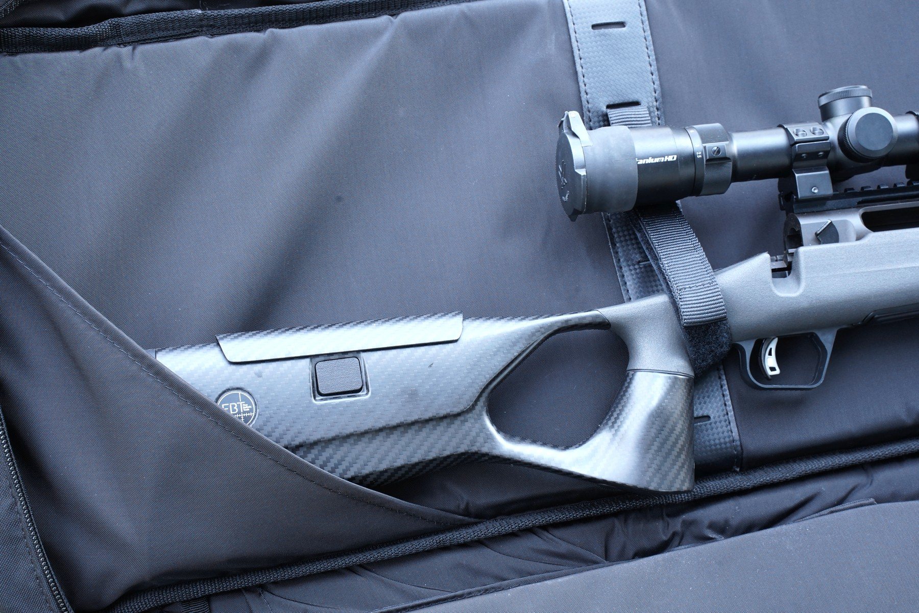 Velcro retention straps and internal muzzle pocket holding a rifle in the Ogden's Tactical 50