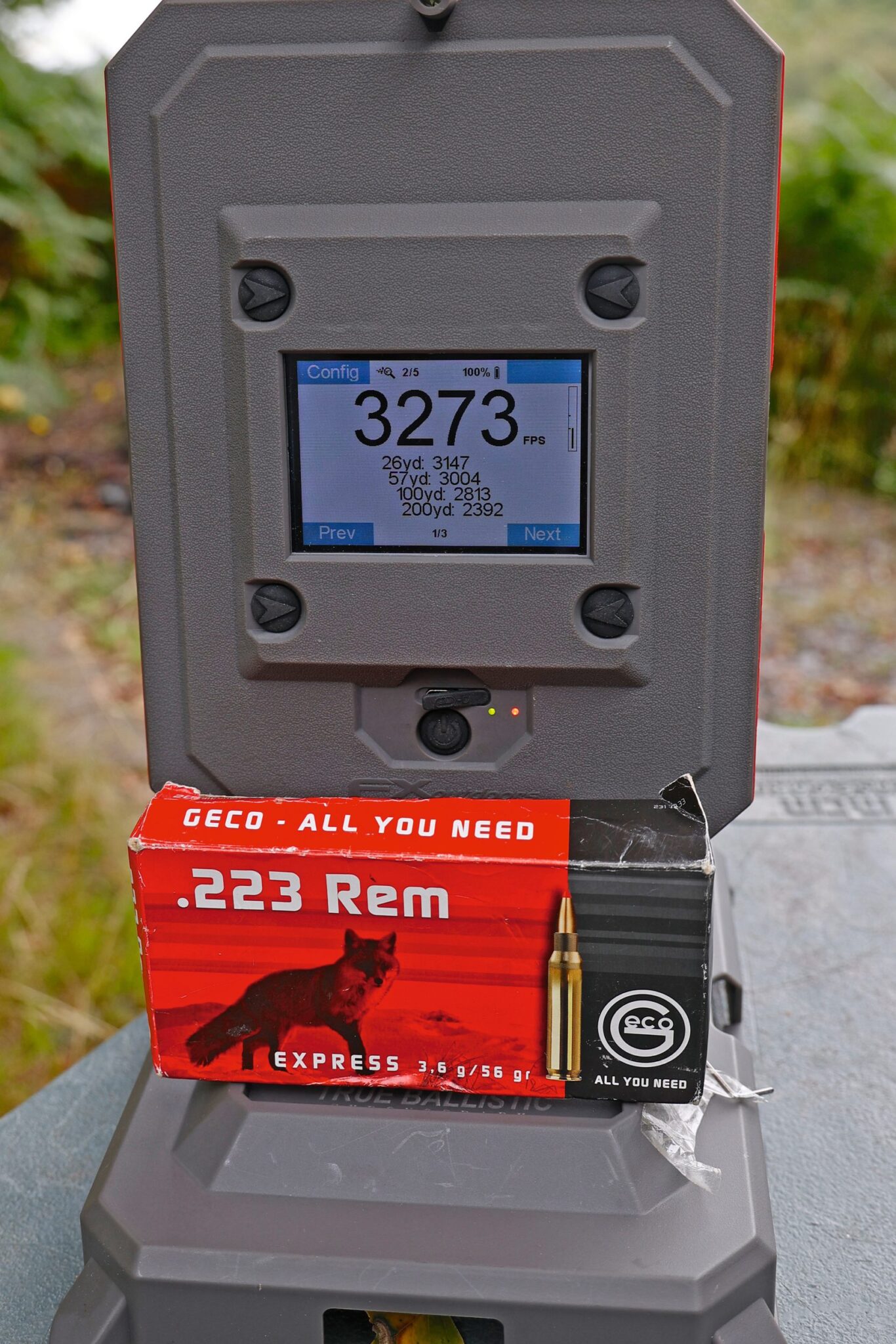Chronograph showing 3,273fps beside a box of Geco Express .223 Rem ammunition
