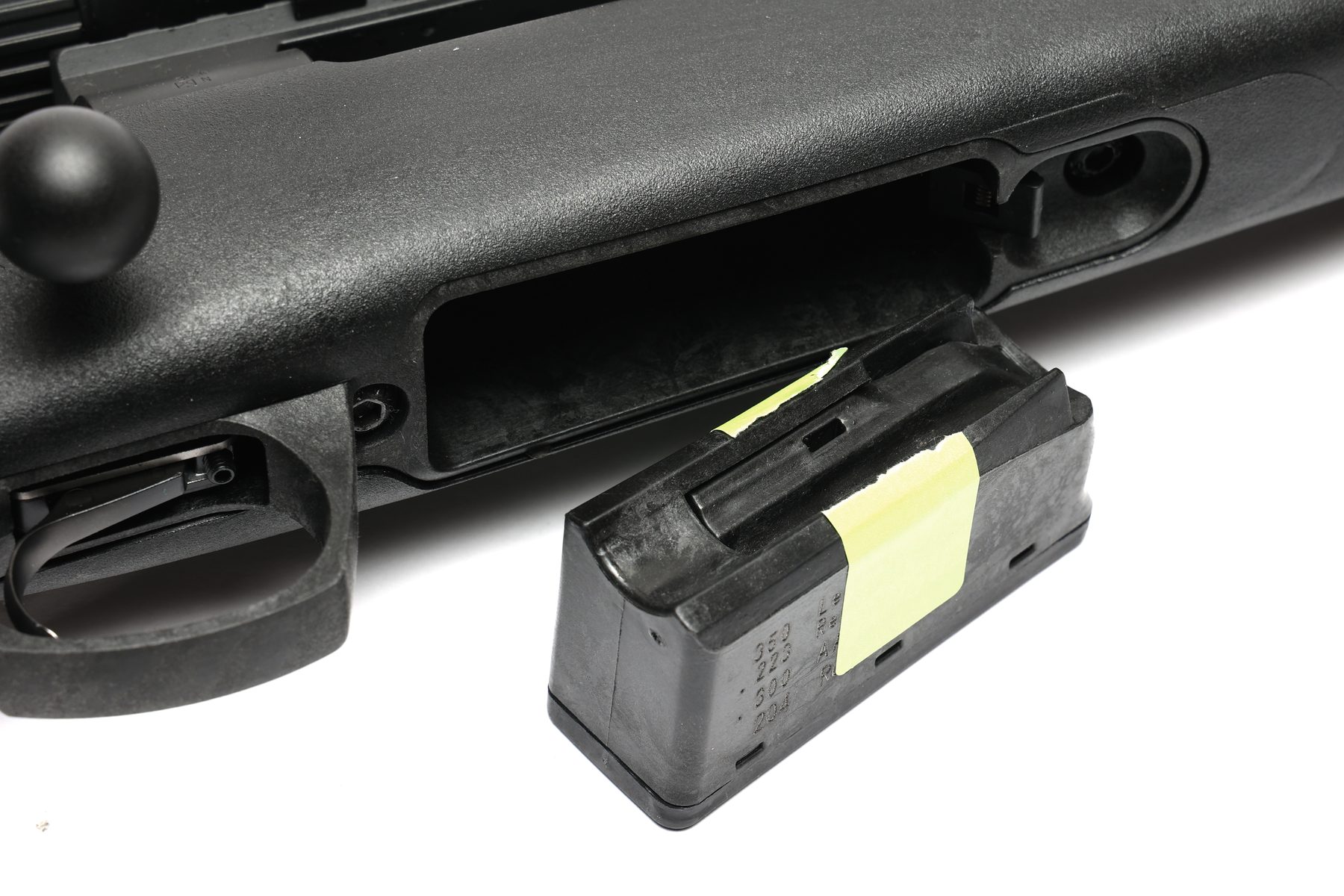 The five-round polymer detachable magazine of the CVA Cascade rifle beside the stock
