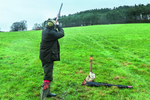 Man with shot load in field