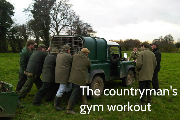 Land Rover being pushed by gamekeepers