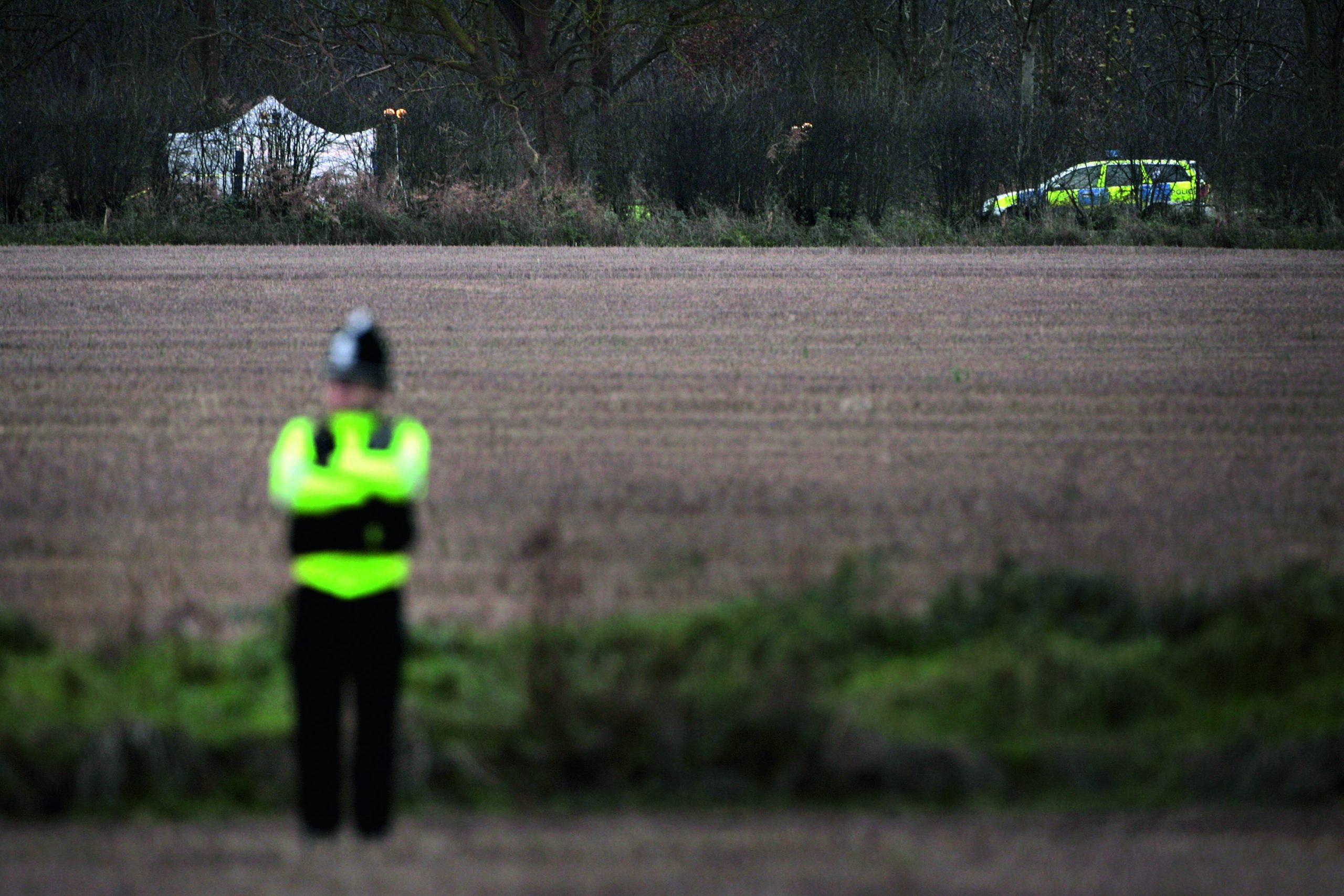 IPSWICH, UNITED KINGDOM - DECEMBER 13: Police guard the perimeter of a crime scene near Levington village where two female bodies were found on December 13, 2006 in Ipswich, England. Forensic teams are searching an area of woodland where the bodies of two women were found yesterday which are believed to be that of missing prostitutes Paula Clennell and Annette Nicholls. (Photo by Bruno Vincent/Getty Images)